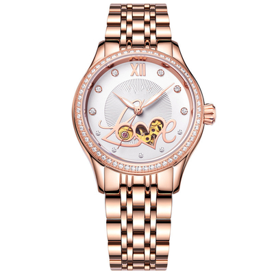 Le manuel de dames s'enroulent observe la montre en céramique en acier de squelette mécanique de mode